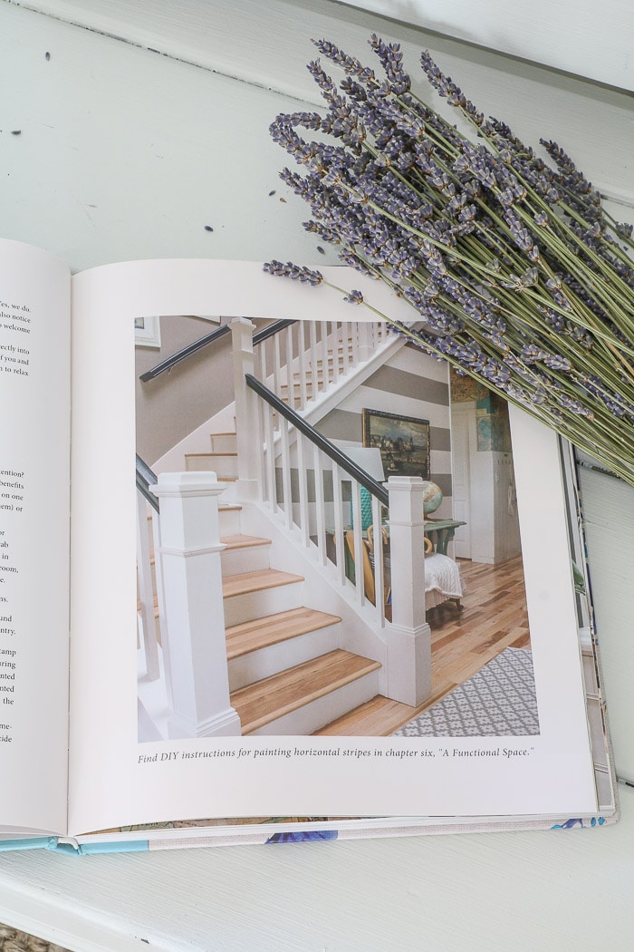 Inside of The Inspired Room by Melissa Michaels.  Dried lavender sitting on the corner of this best interior design book for beginners.