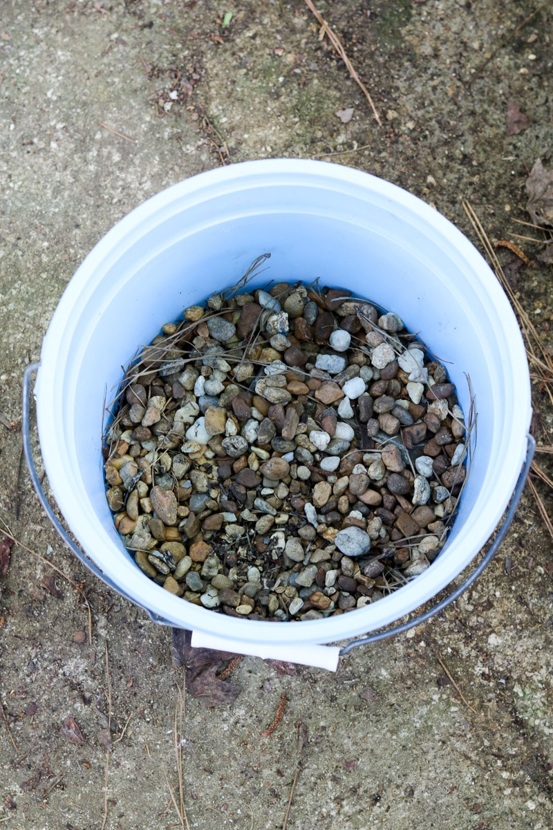 Container flower gardening rocks in the bottom of the pot