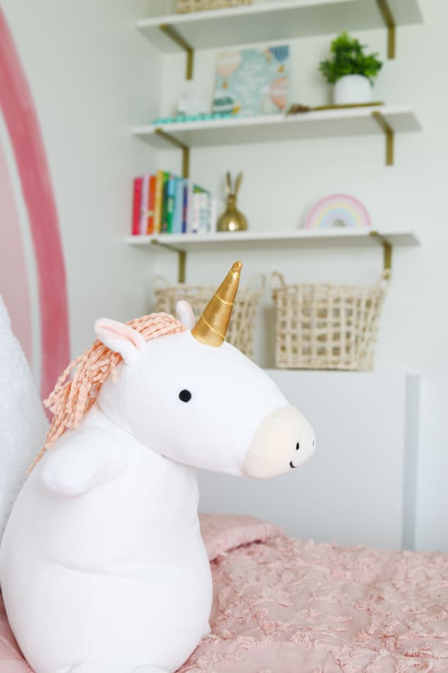 Unicorn stuffed animal bed decoration