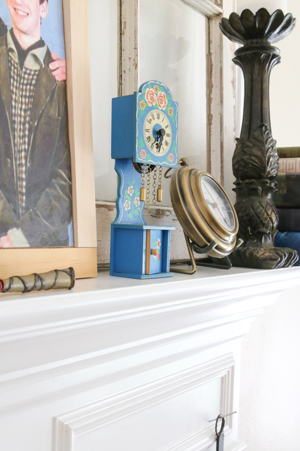 Muggle trinkets on a Weasley burrow decorated mantel