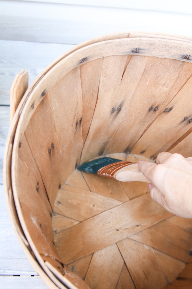 Cleaning in a basket with clean dry paint brush