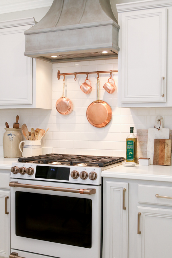 Polishing copper pots and pans that hang over your stove