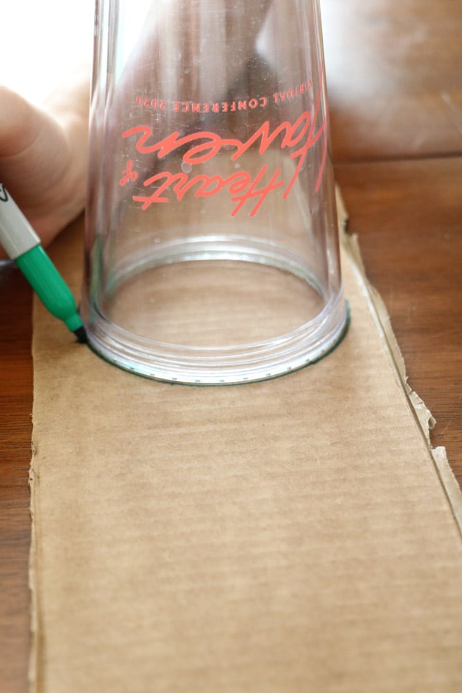 Draw a circle around a cup on a piece of cardboard 