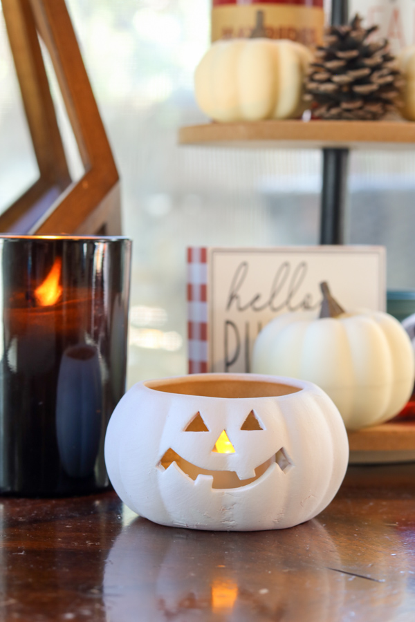 Thrifted jack o lantern candle painted white and used for decorations for Halloween