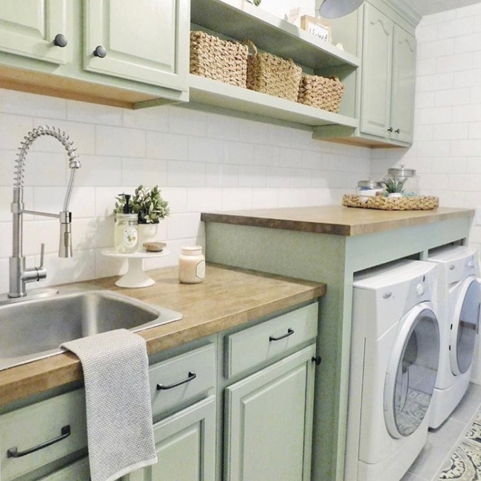 Farmhouse Laundry Room Decor by The Sycamore Farmhouse with mint green cabinetry and a sink
