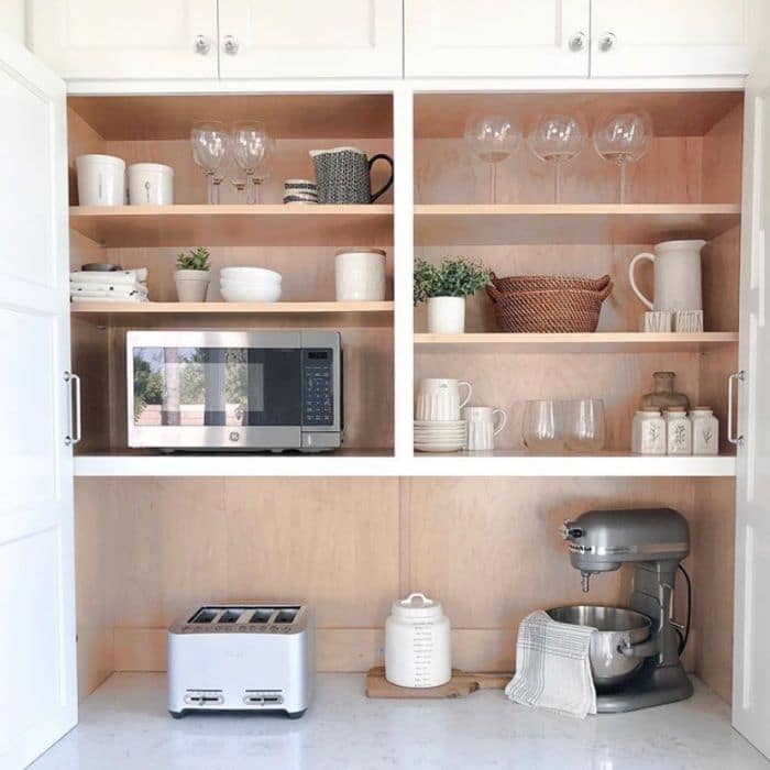 Stylish shelving with hidden microwave by My Hillside Haven