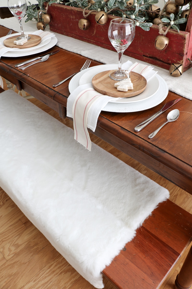 How to style a fur blanket on a bench